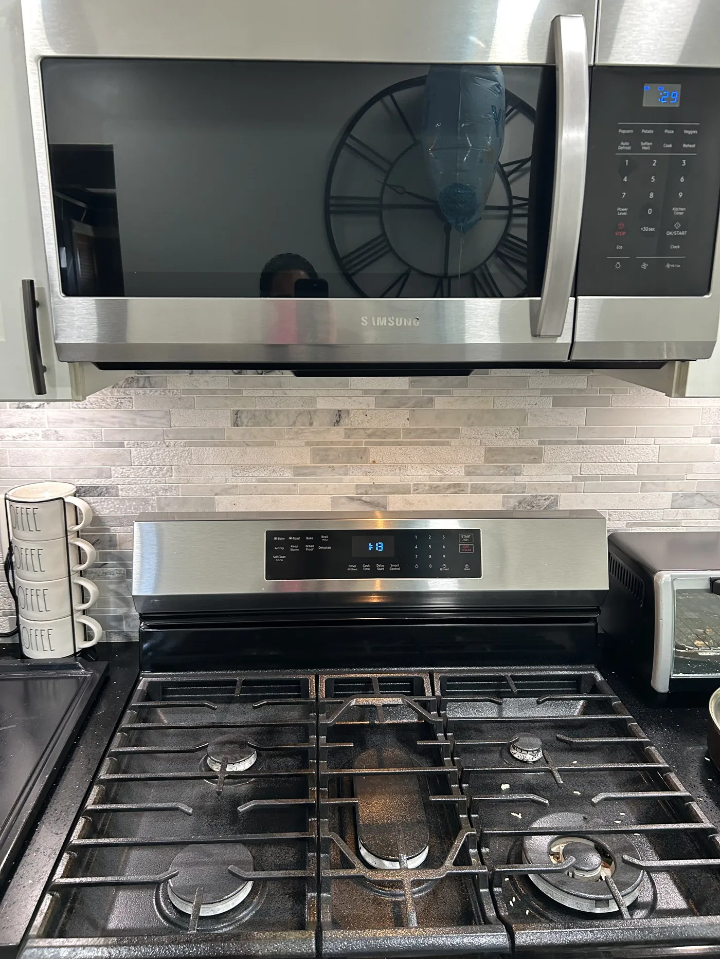 A detailed close-up of a fully cleaned kitchen stove and microwave